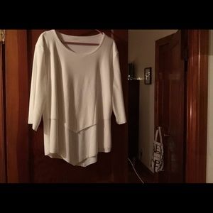 Layered silky-soft blouse in white. No tags